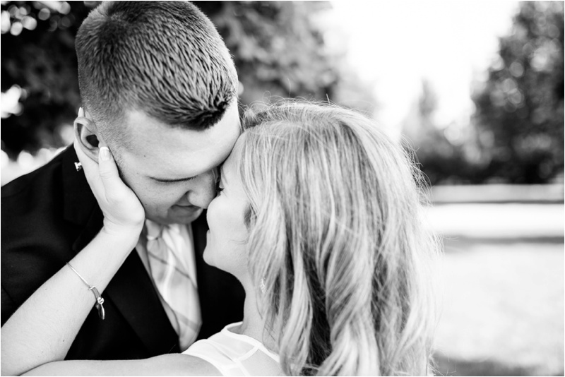 black and white photo of bride and groom about to kiss