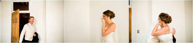 Bride has a first look with her dad as he walks in to see her in the window lit room