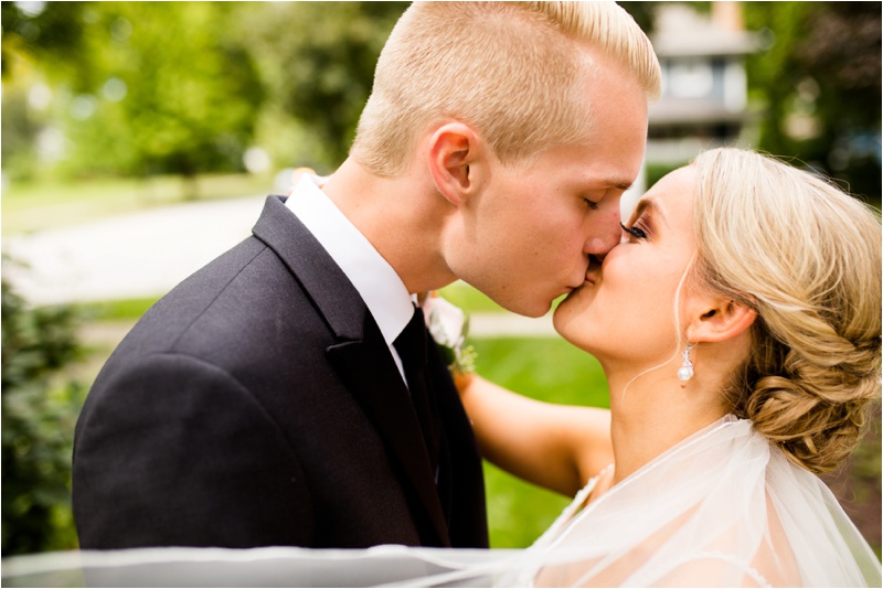 September wedding with bride and groom kissing