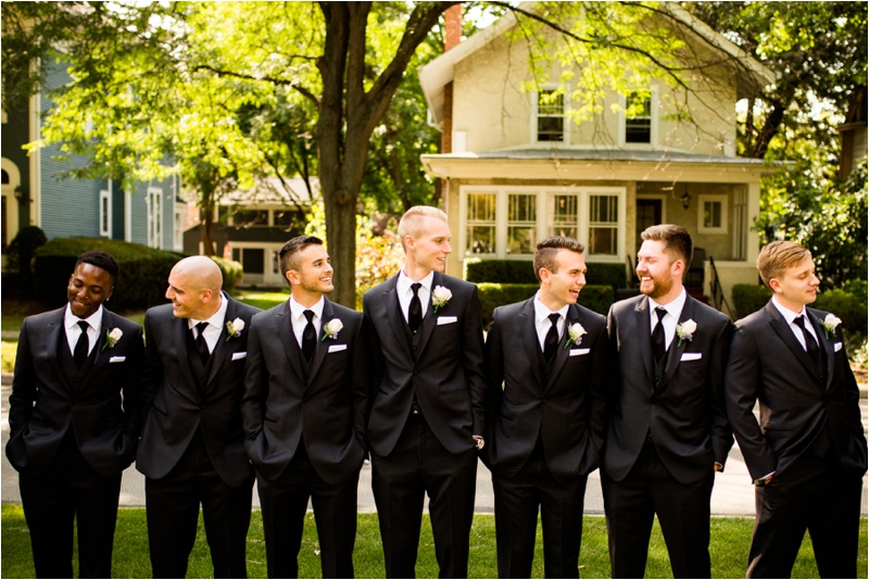 Groomsmen looking at each other and smiling