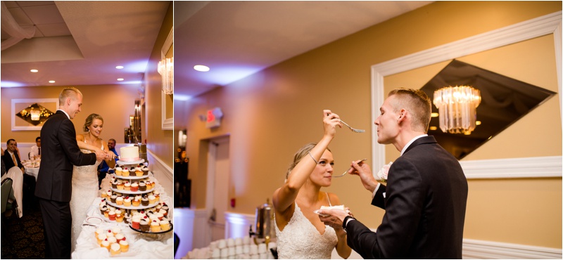 bride and groom take the first bites of their wedding cake