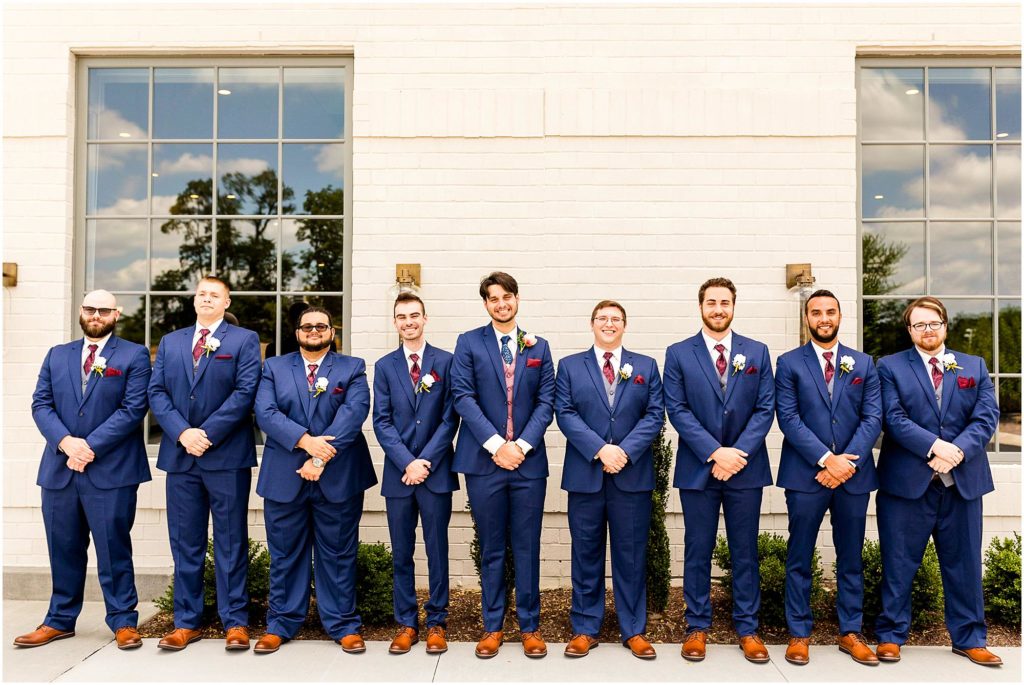 portraits of groomsmen in navy suits in IN by Caitlin and Luke Photography, Indianapolis wedding photographers, Carmel IN wedding photographers