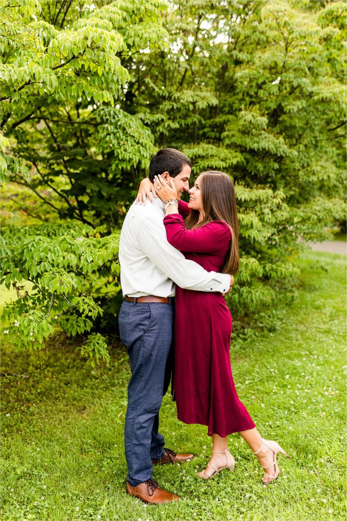first anniversary session with bride in red dress at Washington Park Botanical Garden photographed by Caitlin and Luke Photography, Springfield IL anniversary photos