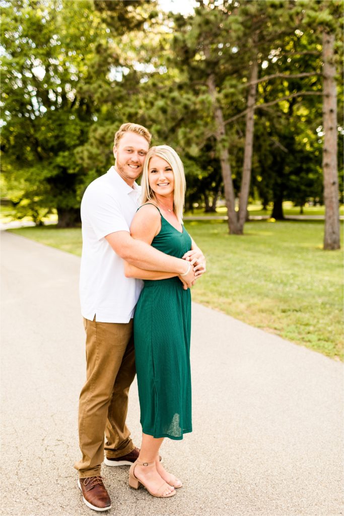 Caitlin and Luke Photography, Washington Park Botanical Gardens engagement photos, Springfield IL engagement session, Washington Park Botanical Gardens engagement session with bride in green dress and groom in white shirt with brown pants in the summer
