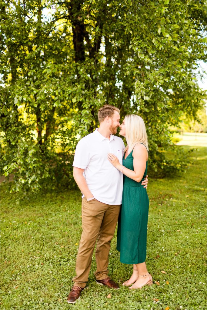 Caitlin and Luke Photography, Washington Park Botanical Gardens engagement photos, Springfield IL engagement session, Washington Park Botanical Gardens engagement session with bride in green dress and groom in white shirt with brown pants in the summer