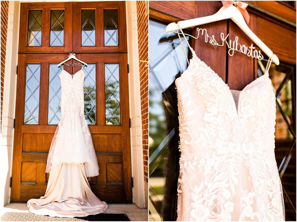 wedding dress hangs on church door photographed by Caitlin and Luke Photography, St. Michael's Church wedding, Fort Loramie OH wedding photographers, church wedding, Ohio wedding photographers