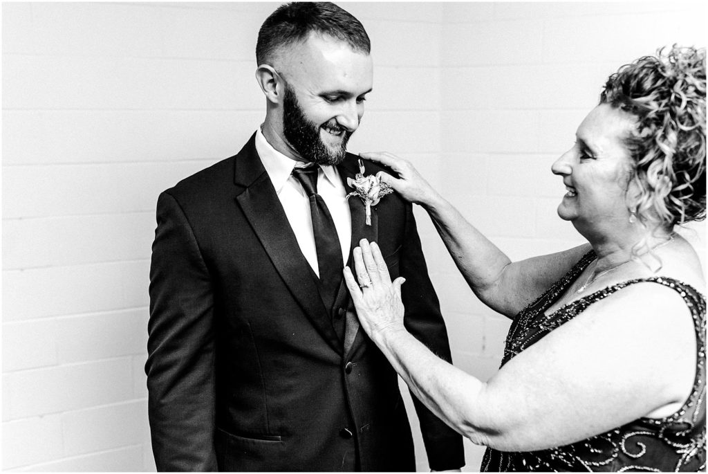 groom prepares for wedding day with Caitlin and Luke Photography | The Warehouse on State wedding, Peoria IL wedding photographers, Illinois wedding photographers, IL wedding day