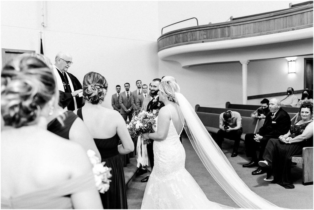 traditional church wedding in Illinois photographed by Caitlin and Luke Photography | The Warehouse on State wedding, Peoria IL wedding photographers, Illinois wedding photographers, IL wedding day