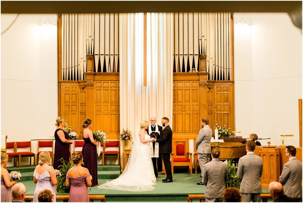 traditional church wedding in Illinois photographed by Caitlin and Luke Photography | The Warehouse on State wedding, Peoria IL wedding photographers, Illinois wedding photographers, IL wedding day
