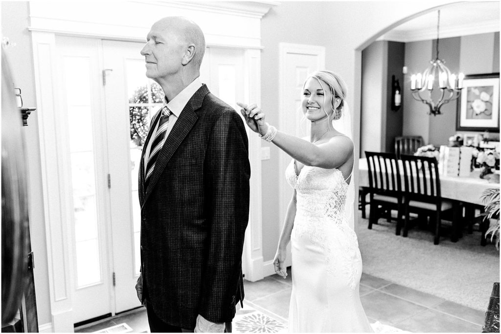bride and dad first look photographed by Caitlin and Luke Photography, Bloomington Wedding Photographers, Illinois Wedding Photographer, Holiday Inn & Suites Bloomington Wedding Photos