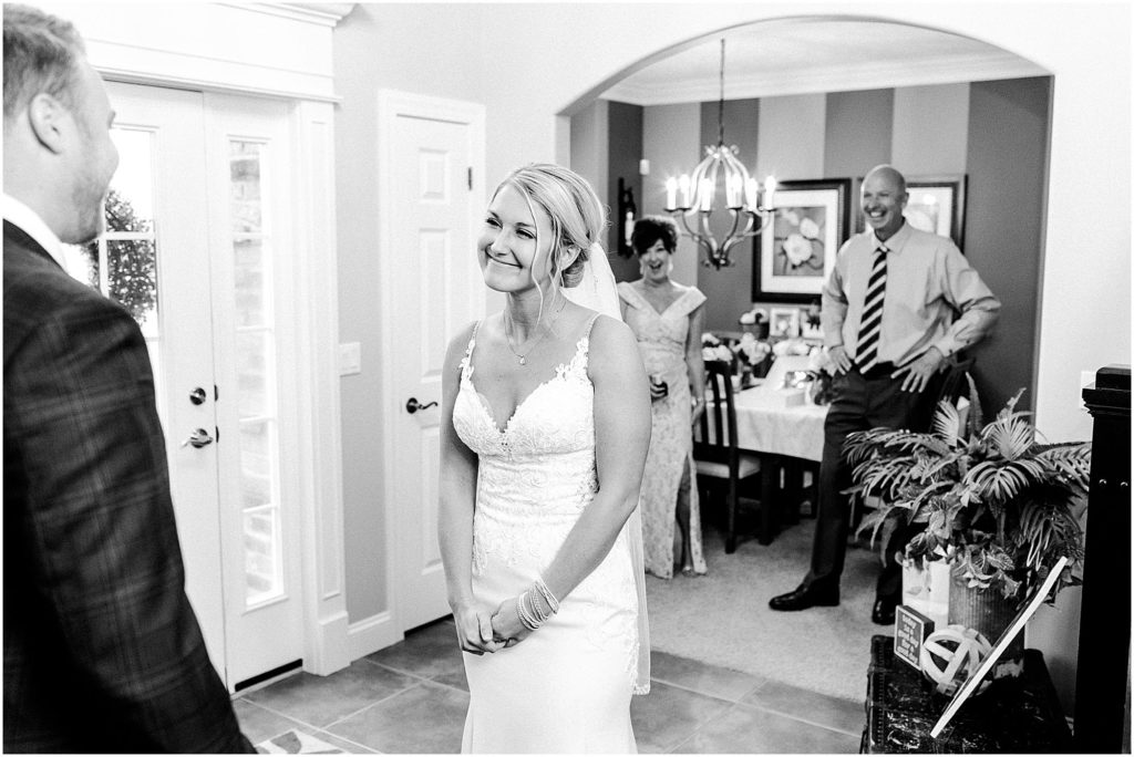 first look photographed by Caitlin and Luke Photography, Bloomington Wedding Photographers, Illinois Wedding Photographer, Holiday Inn & Suites Bloomington Wedding Photos