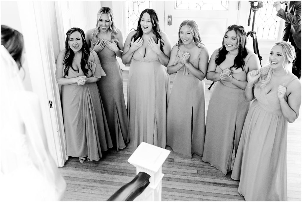 first look for bride and bridesmaids before Pritzlaff Events wedding in Milwaukee WI photographed by Wisconsin wedding photographers Caitlin and Luke Photography