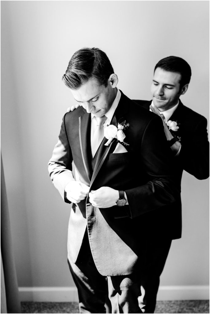 groom prepares for Pritzlaff Events wedding in Milwaukee WI photographed by Wisconsin wedding photographers Caitlin and Luke Photography