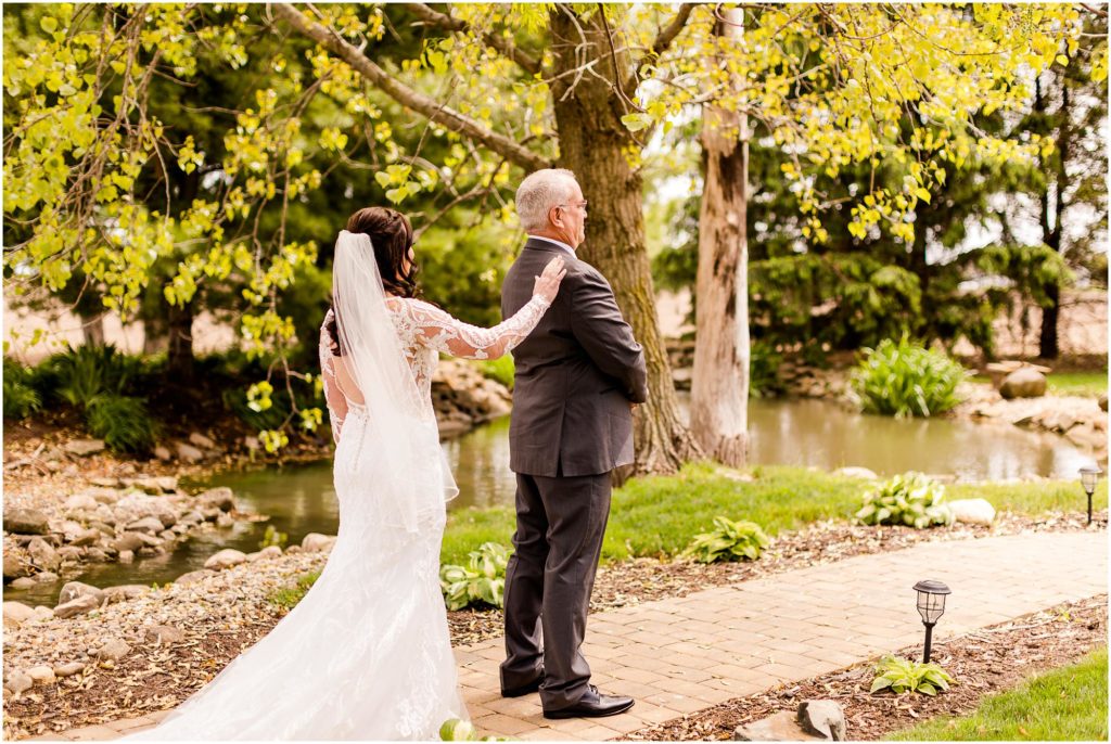 first look with bride and dad before spring Pear Tree Estate wedding photographed by Champaign Illinois wedding photographers Caitlin and Luke Photography