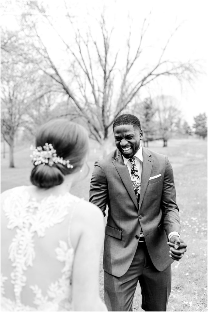 first look before Countryside Banquet Facility wedding photographed by Bloomington Illinois wedding photographer Caitlin and Luke Photography, IL wedding day in the spring